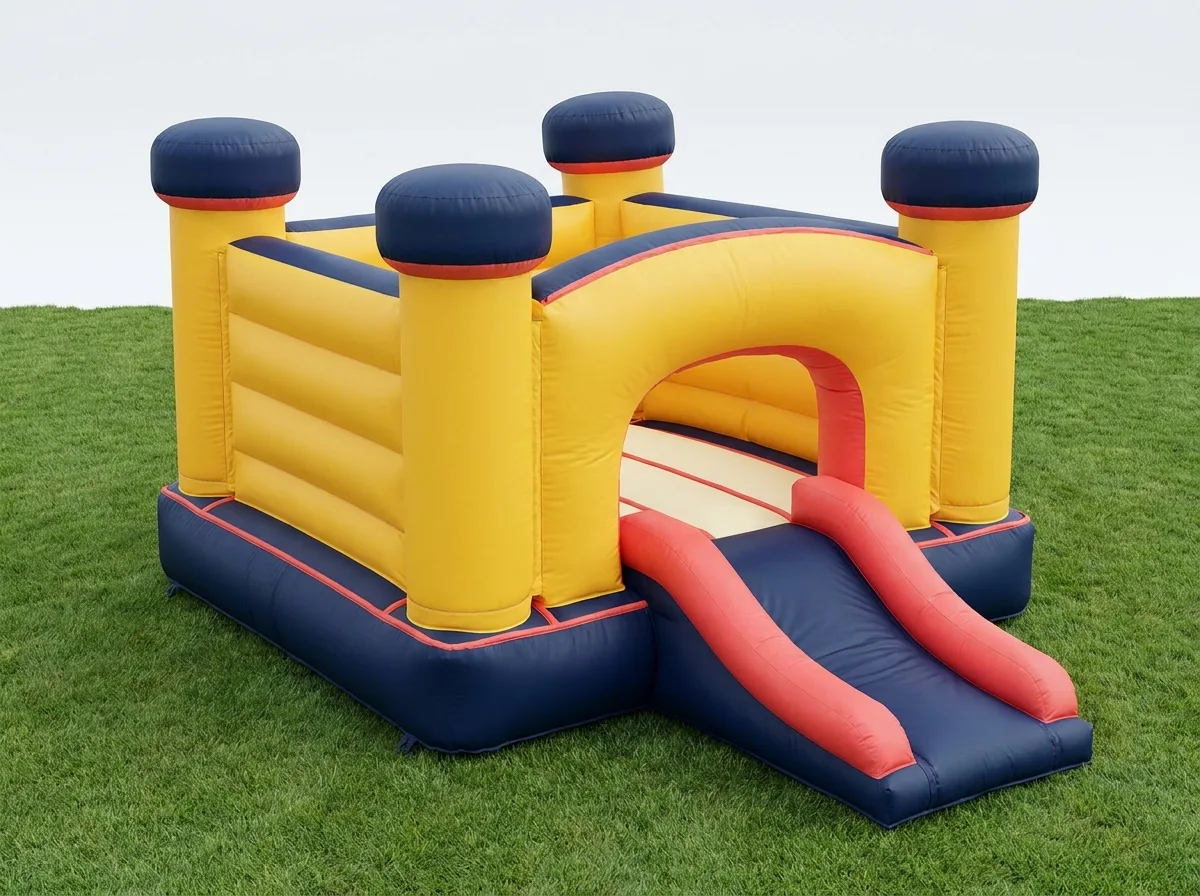 Bouncy castle with attached front slide, yellow with navy turrets and coral trim